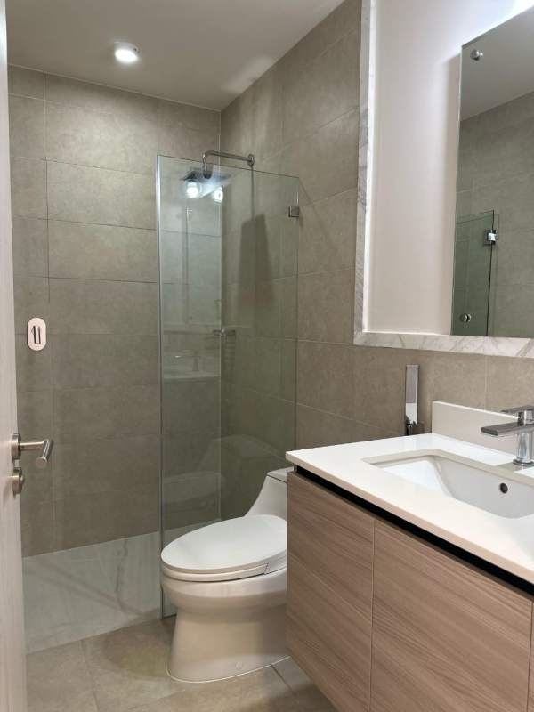 Bathroom with glass shower, floating vanity, beige tile Ocean House Santa Maria Panama