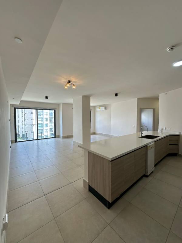 Minimalist kitchen with pendant lights, peninsula counter, stainless appliances in Ocean House Panama
