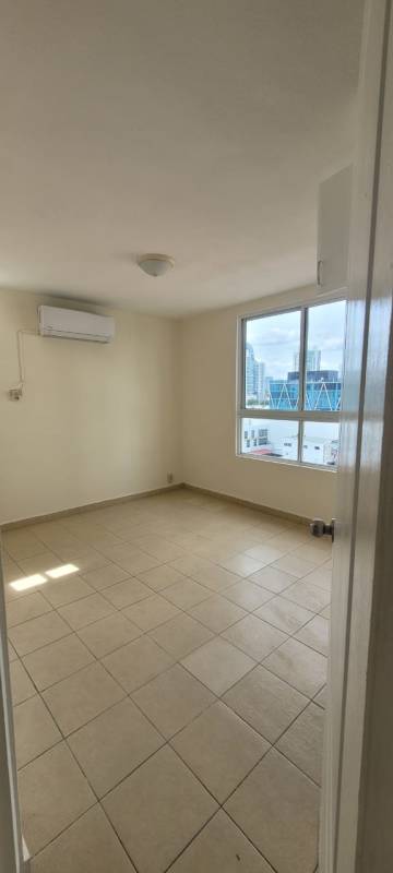 Empty bedroom with AC and large window city view PH Casa Real San Francisco Panama