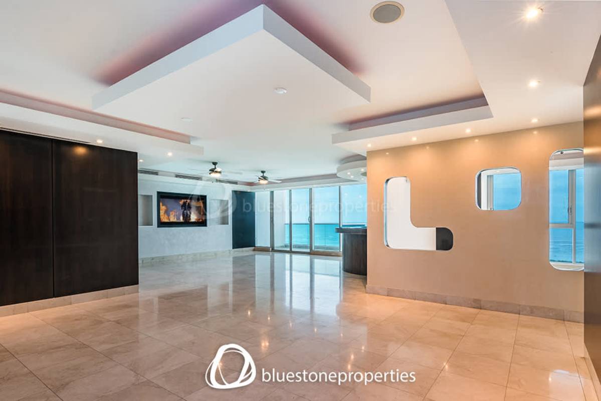 Contemporary kitchen with granite countertops and dark cabinetry Costa del Este