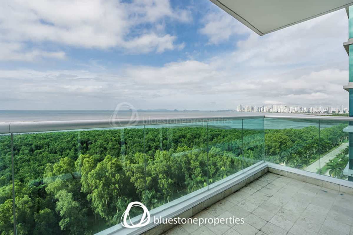 Master bedroom with large windows and city skyline view in PH Lumiere Costa del Este