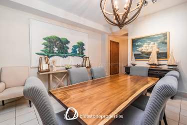 Patio terrace with private pool, outdoor dining beside lush gardens and golf course in Buenaventura Panama