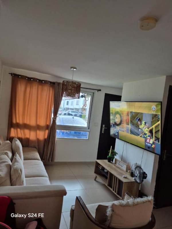 Contemporary living room with flat TV, sofa and tiled floors PH Villa Sol townhouse in El Crisol Panama