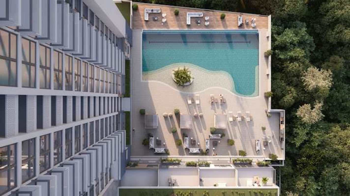 Rooftop terrace with Jacuzzi, lounges, and forest views at PH Oceana Residences Panama City