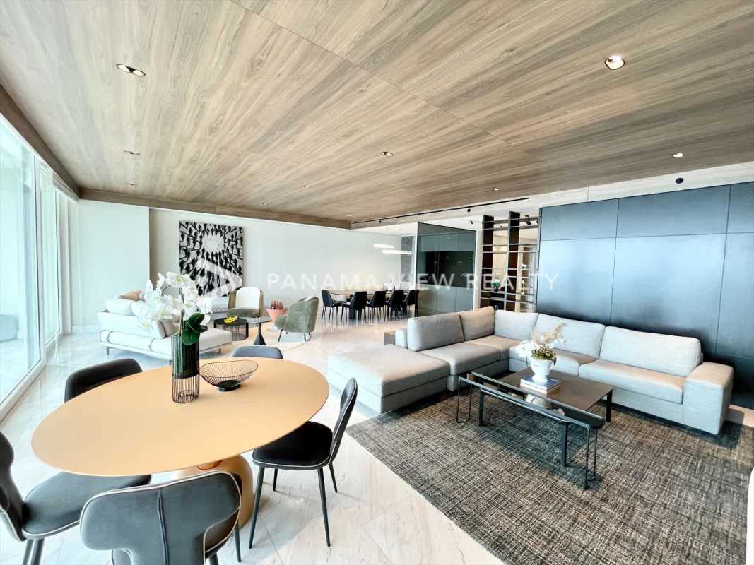 Spacious chef-style kitchen with marble countertops and island at The Towers Punta Paitilla Panama City