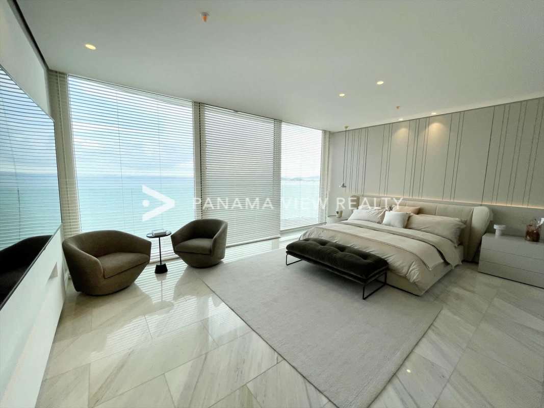 Modern bathroom with double vanity, marble tiles, and walk-in shower in The Towers Punta Paitilla Panama City