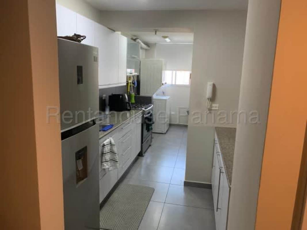 Contemporary kitchen with appliances white cabinets gray countertops PH Altos de Golf Panama City