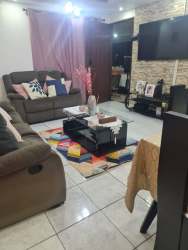 Functional kitchen with cabinetry and refrigerator in Barriada Los Sauces Arraiján