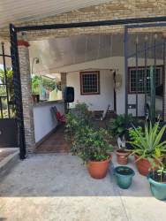 Living and dining area with accent wall and entertainment space Barriada Los Sauces Panama