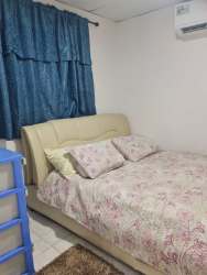 Elevated water tank, outdoor sink, and service space at house Barriada Los Sauces Panama