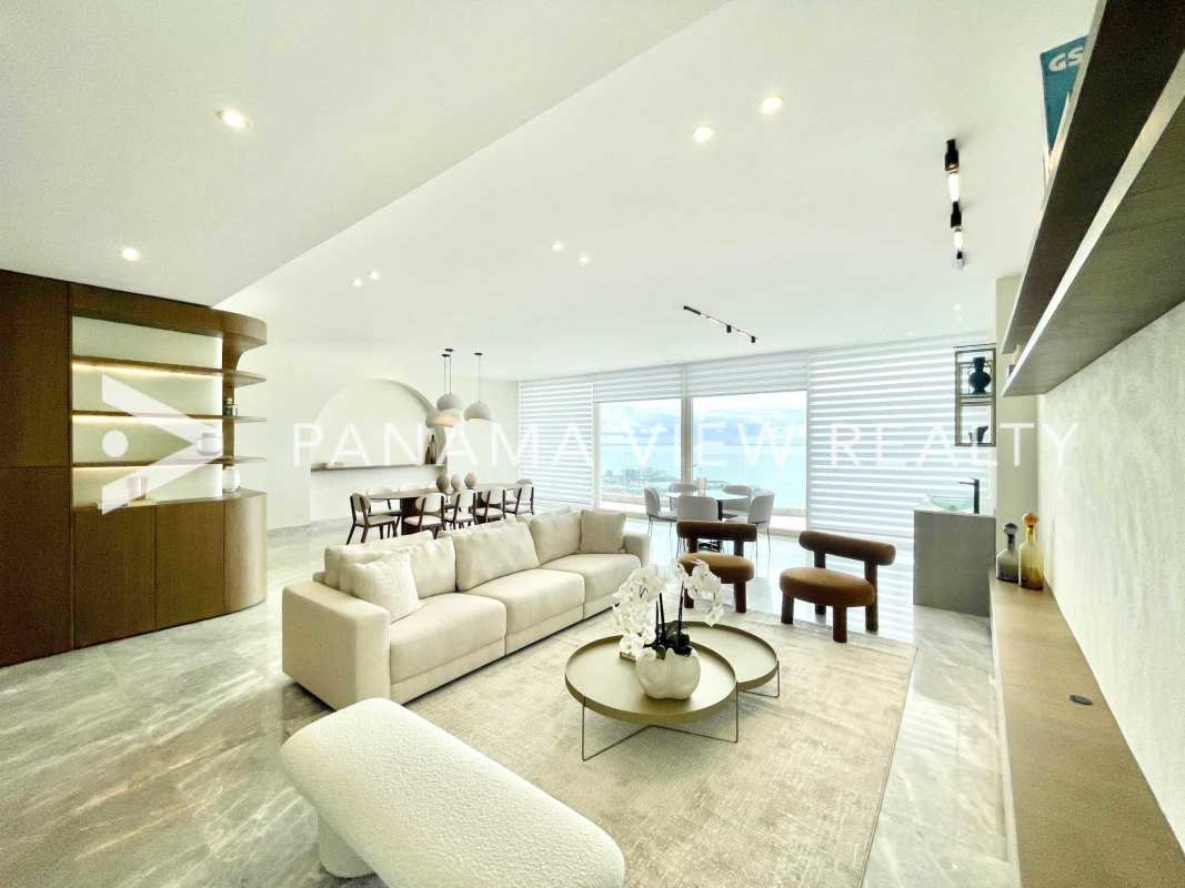 Large dining area with floor-to-ceiling windows overlooking Pacific Ocean at PH The Towers Punta Paitilla Panama