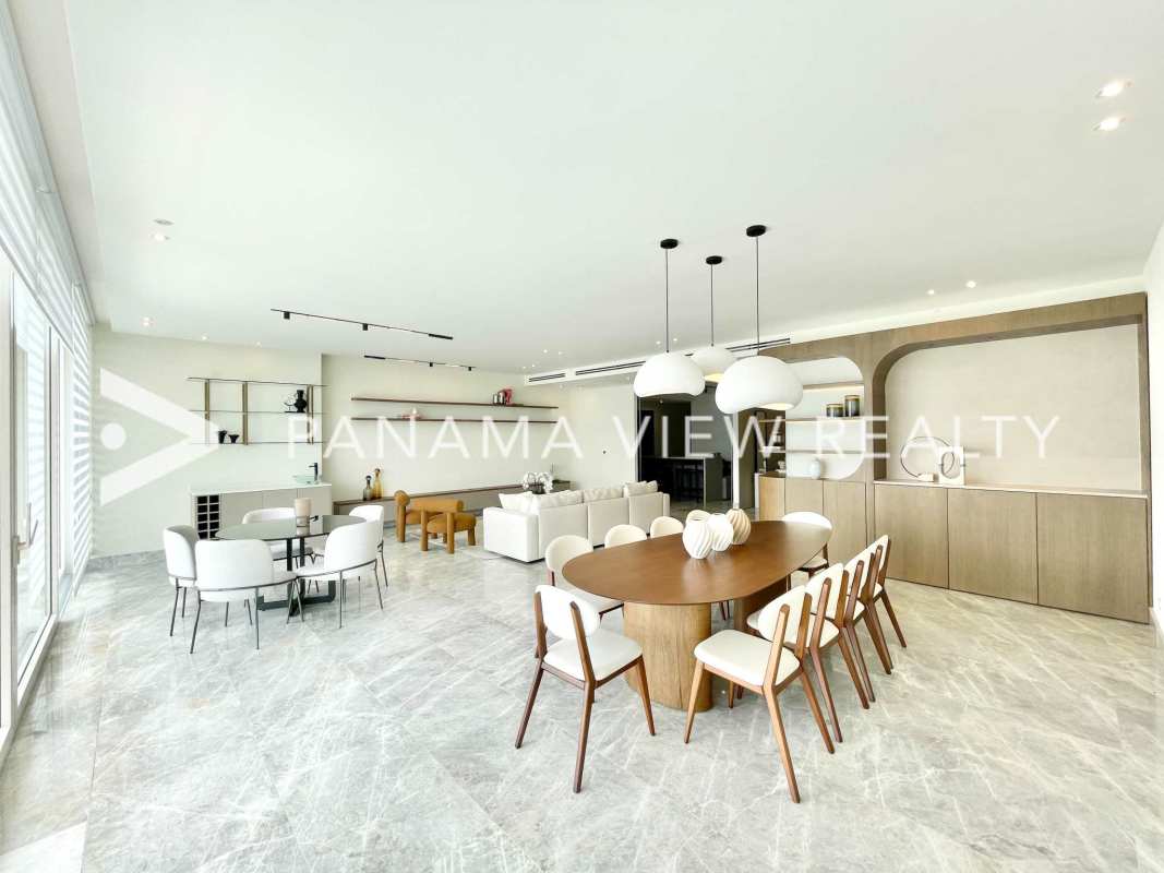 Elegant bedroom featuring floor-to-ceiling ocean views, marble floors, luxurious furnishings at The Towers Punta Paitilla Panama