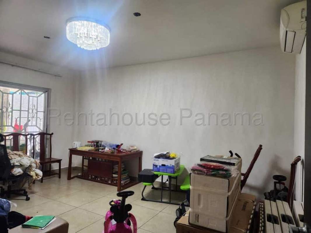 Living room with tiled floors, chandelier, air conditioning in PH Dorado Village Condado del Rey Panama