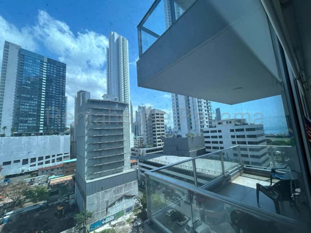 Private balcony with glass railing overlooking Panama skyline and Pacific Ocean from PH Vista Balboa