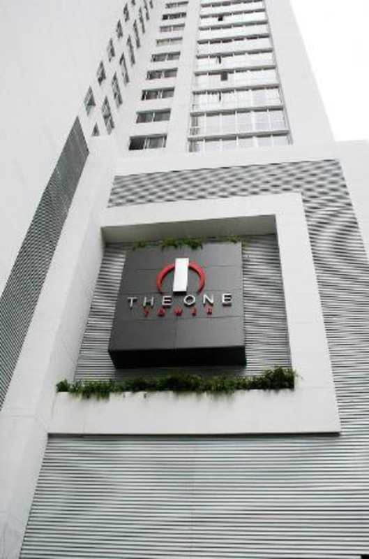 Modern hallway with wall art and neutral tones inside The One Tower Panama apartment