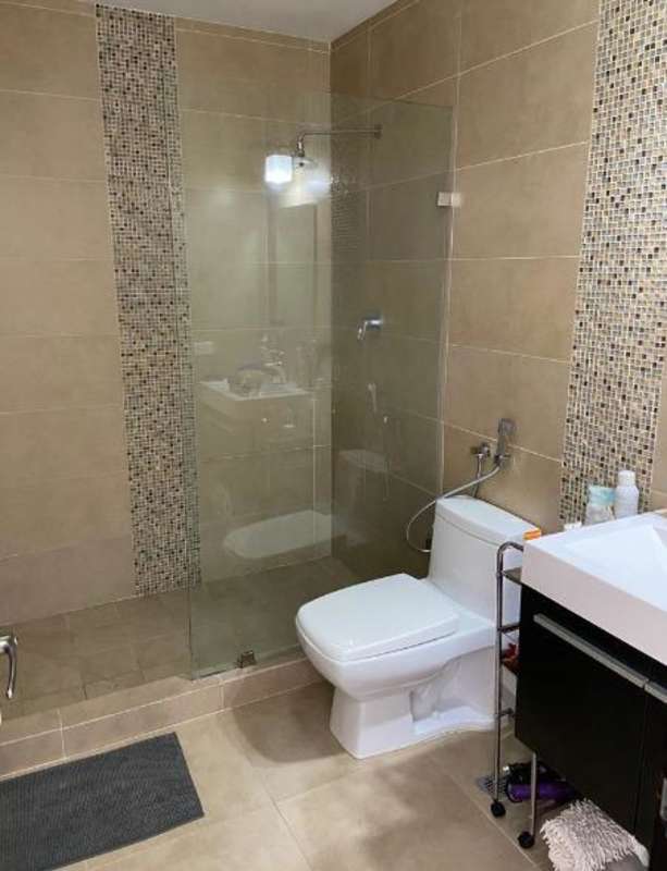 Kitchen with granite countertop and cabinetry in apartment The One Tower Panama