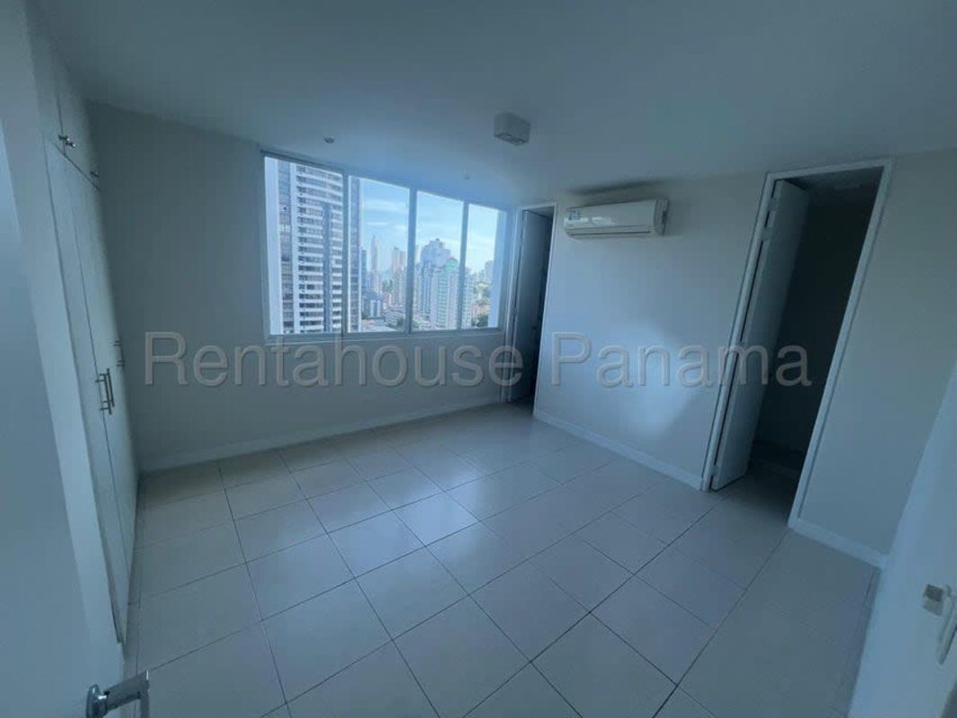 Bathroom with glass-enclosed shower, vanity and marble tiles PH Mont Royale Panama