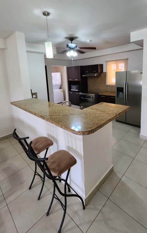 Modern kitchen with stainless steel appliances, granite countertops in PH Embassy Club Clayton Panama