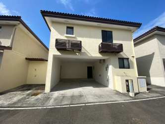 Two-level house with driveway and parking at River Valley Panama Pacifico development