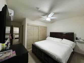 King-size bedroom split AC TV balcony access Playa Caracol Panama