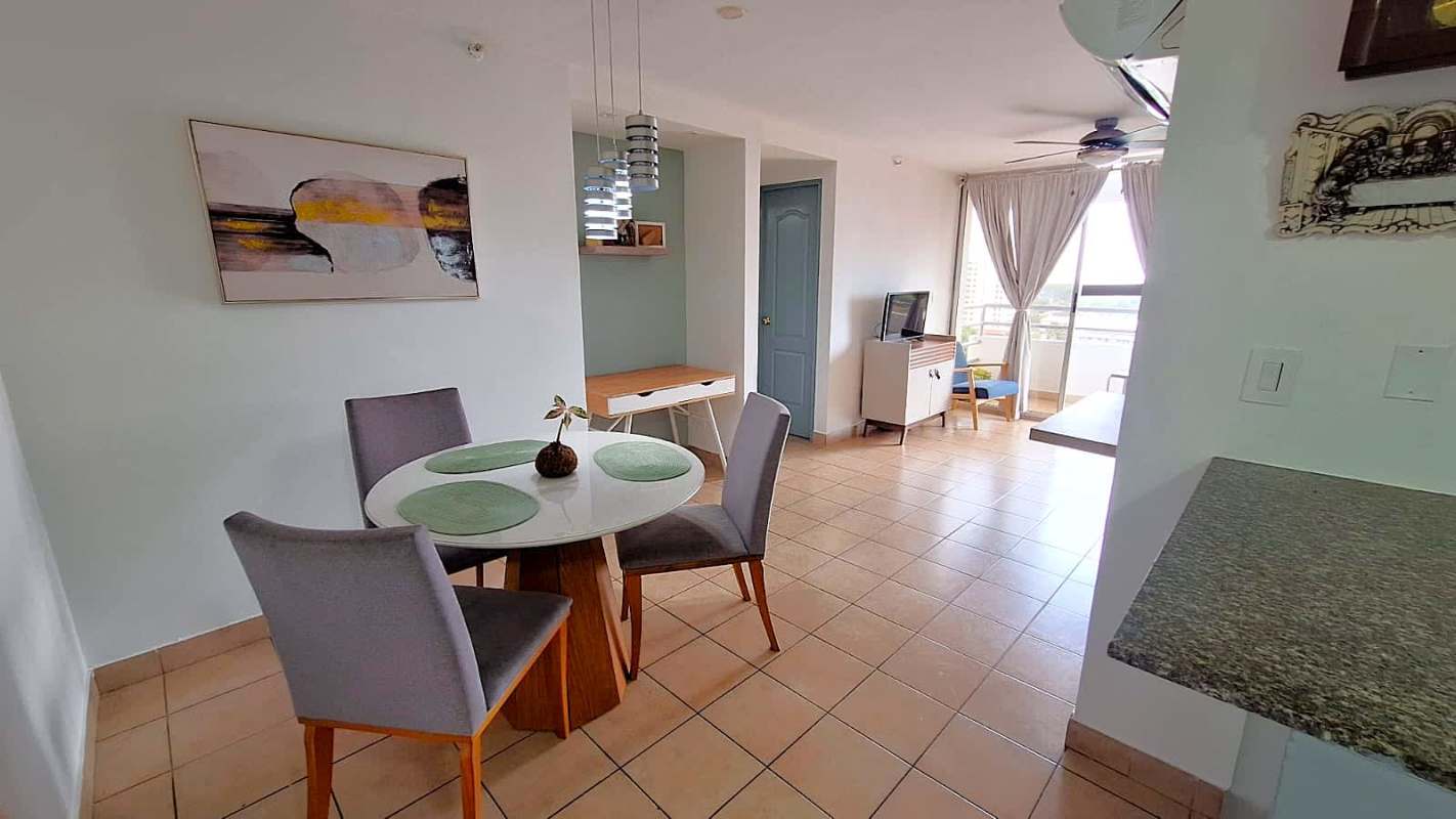 Living room with balcony, large window, ceiling fan, sofa in PH Parque Lefevre Sky Panama