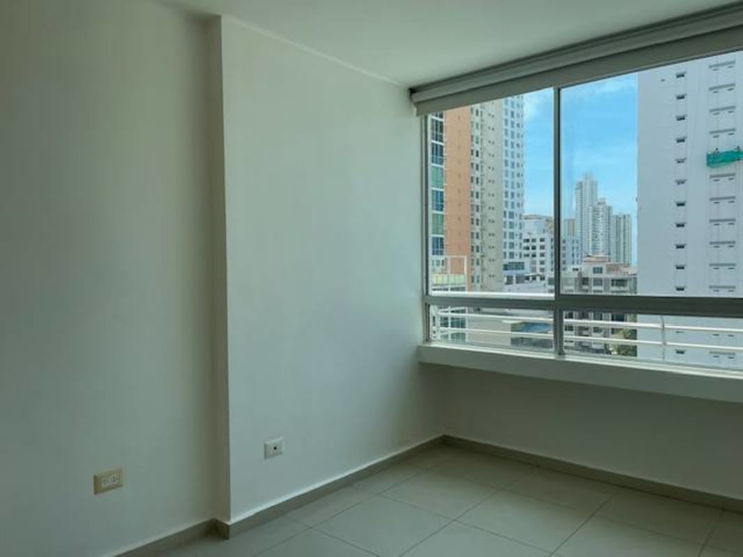 Empty bright room with large window city view PH Citrus San Francisco Panama