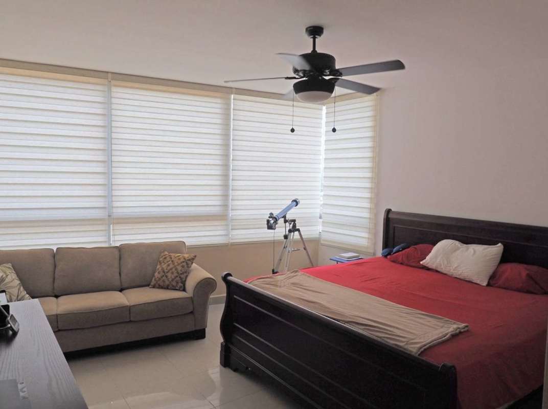 Contemporary master bedroom corner windows view furnished apartment PH Elevation Tower Panama