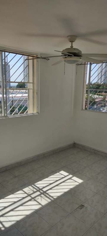 Corner bedroom with tiled floor, ceiling fan and natural light in Parque Lefevre Panama City