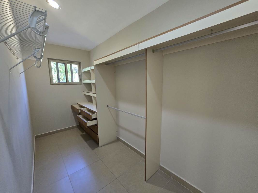 Master bedroom en suite walk-in closet garden view PH Embassy Gardens Clayton Panama