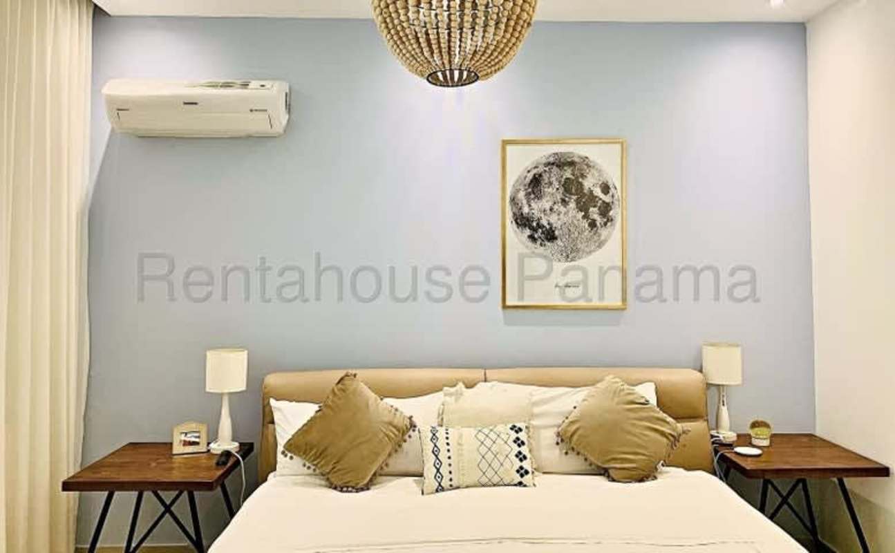 Spacious modern living room opening onto balcony with skyline view at Quadrat Tower Panama