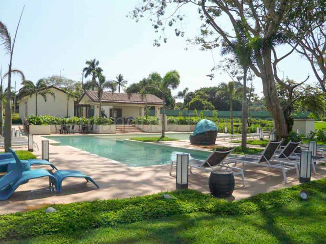 Outdoor swimming pool with deck and landscaping PH River Valley Panama Pacifico
