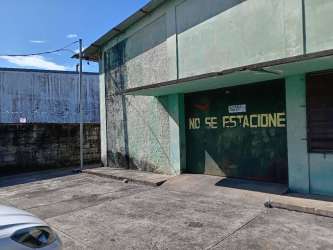 Commercial warehouse facade with secure fencing and parking Bugaba David Chiriquí Panama