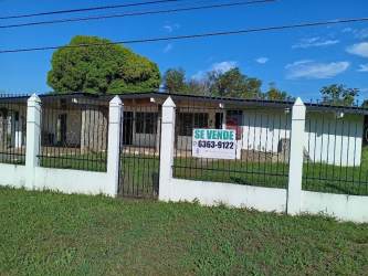 White perimeter fence and iron gate in Dolega property ideal for home or business