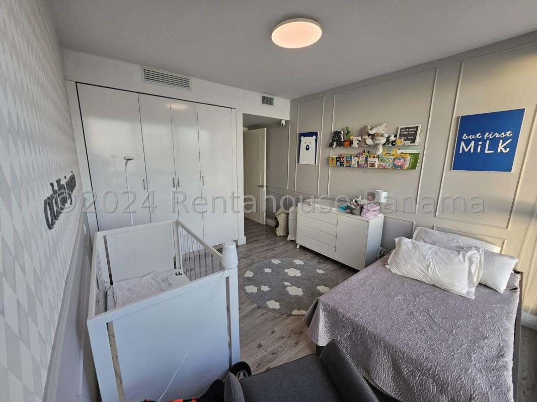Modern nursery with large windows and Pacific Ocean backdrop in PH Oceanaire Panama City