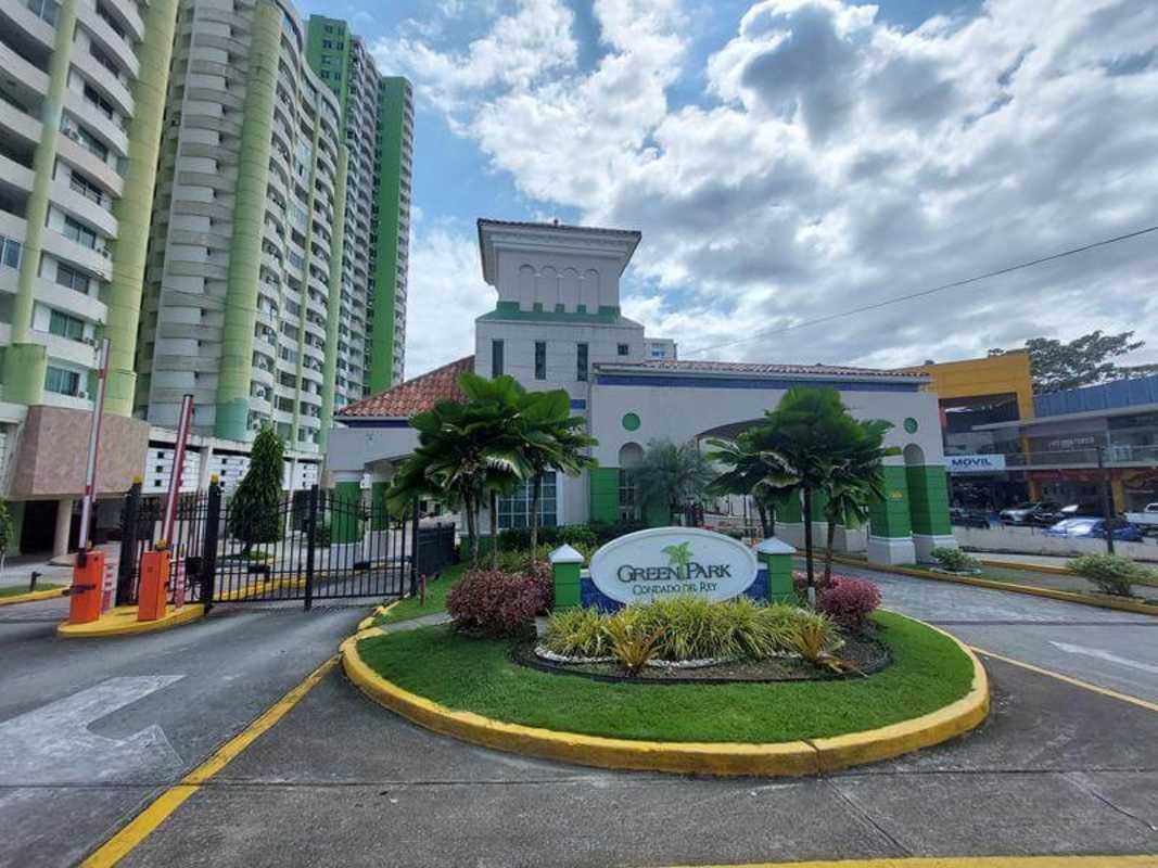 Security gated entrance with tower buildings PH Green Park Villa de las Fuentes Panama City