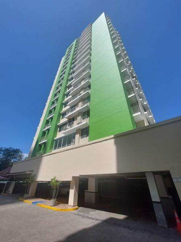 Contemporary green and white apartment tower PH Green Park Villa de las Fuentes with parking area Panama City