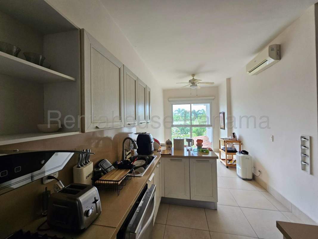 Fully equipped kitchen with island, modern appliances, marble floors at PH The Reserve Santa Maria Panama