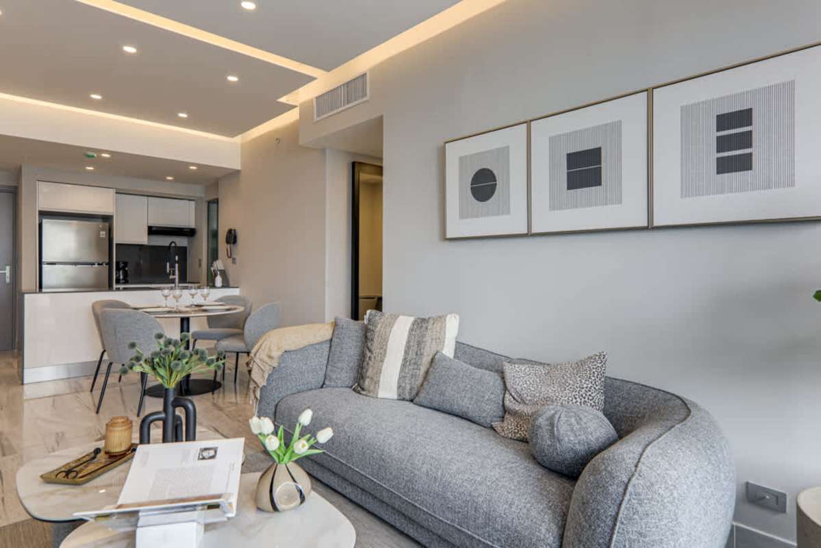 Elegant kitchen with high-end appliances open to living room at Nuovo Bella Vista Panama City