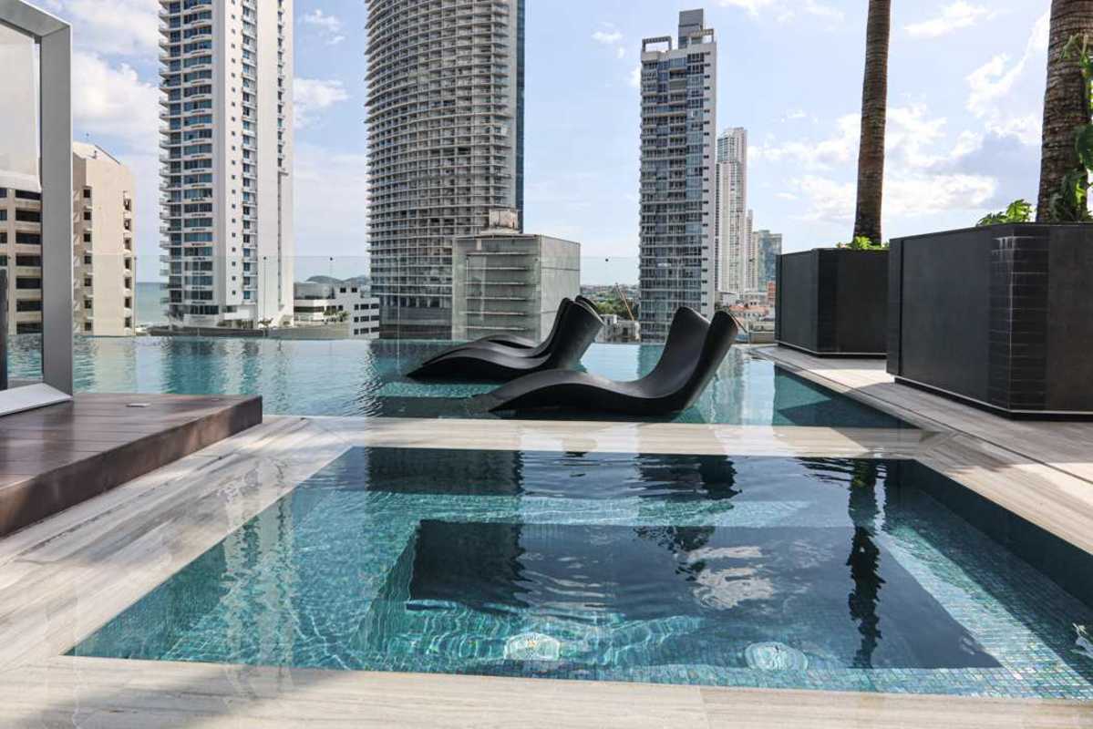 Home office space enclosed with glass doors in Nuovo apartment Bella Vista Panama City