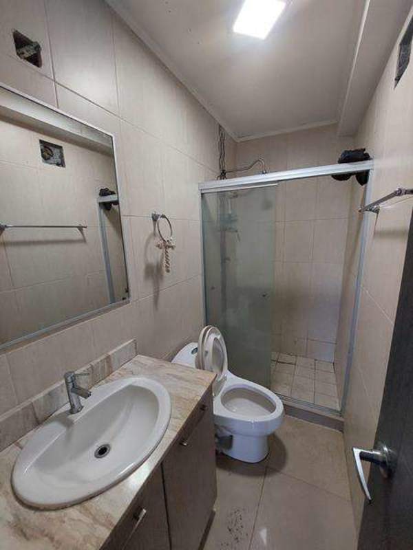 Contemporary bathroom with tile shower enclosure toilet vanity PH Green Park apartment Panama City