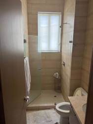 Spacious en-suite bathroom glass enclosed shower in PH Bijao Resort apartment Panama for sale
