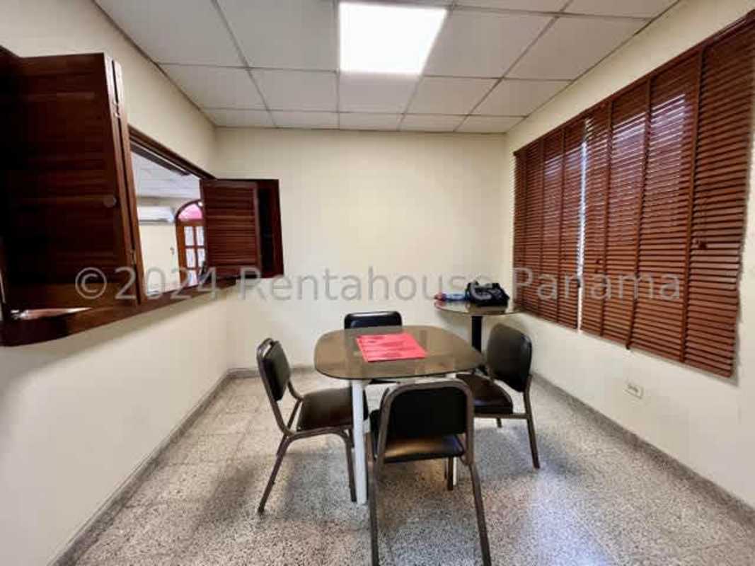Dining space or meeting room with pass-through window and blinds in Chanis Panama