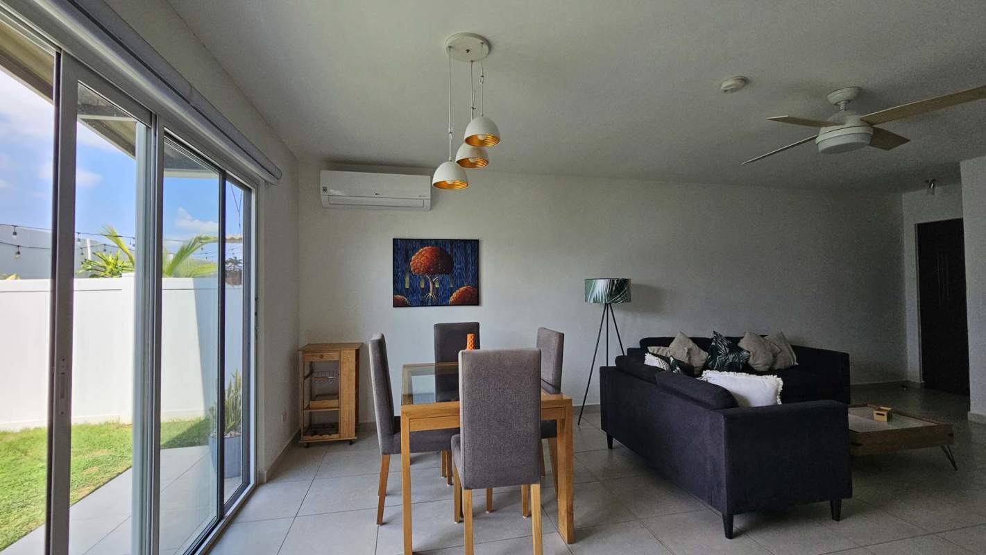 Bedroom with built-in closet and tiled floor at Villa Sur Costa Sur Panama City