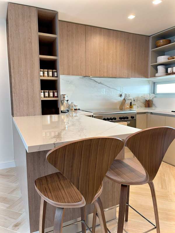 Spacious living room with large windows and ocean views PH Nautica Coco del Mar