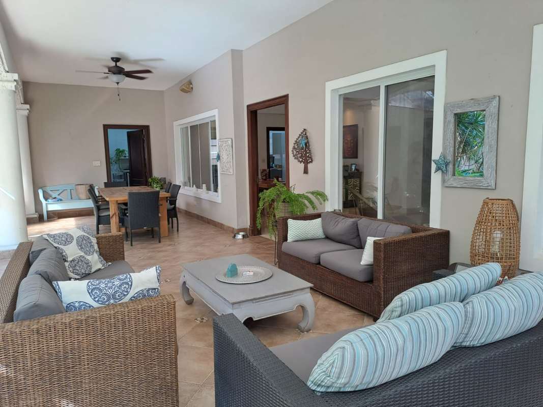 Home theater room with projector and red accents luxury Costa del Este house Panama