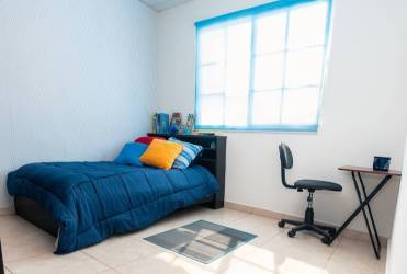 Bedroom bright with tile floors and window in Villas de Roma Arraiján Panama