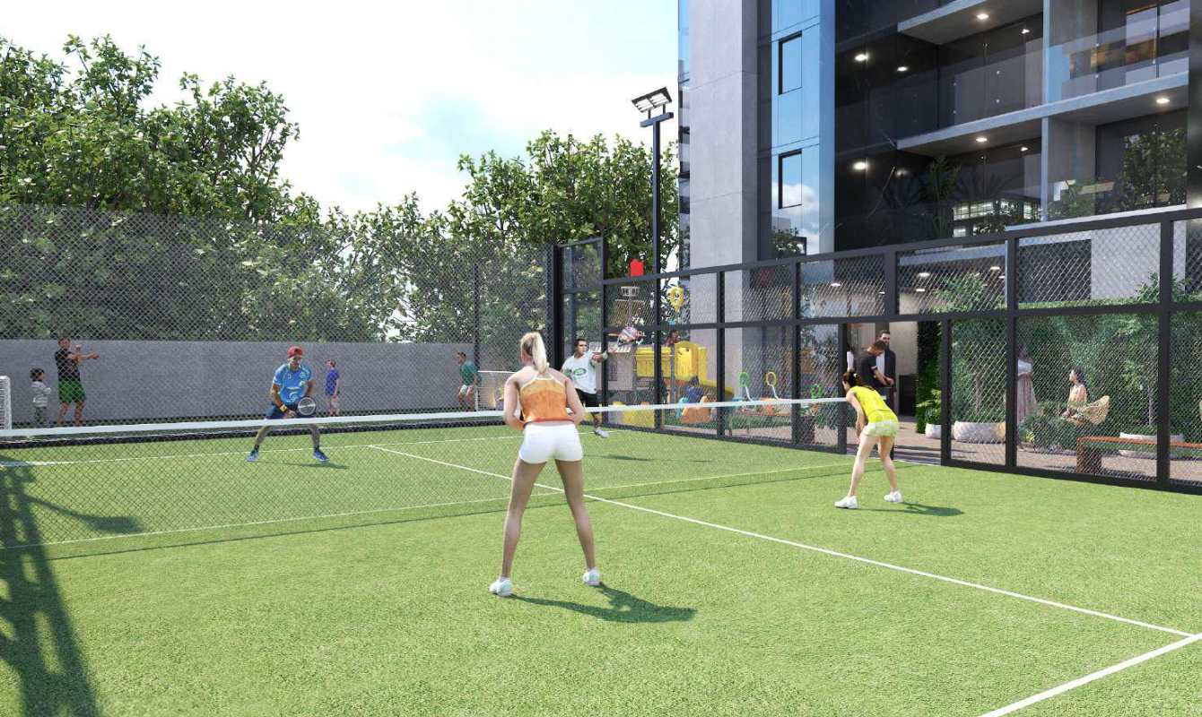 Modern residential paddle tennis court with greenery and balconies at X The Building San Francisco Panama