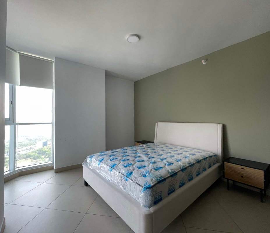 Living area with city skyline view through large windows penthouse PH Country Club Panama