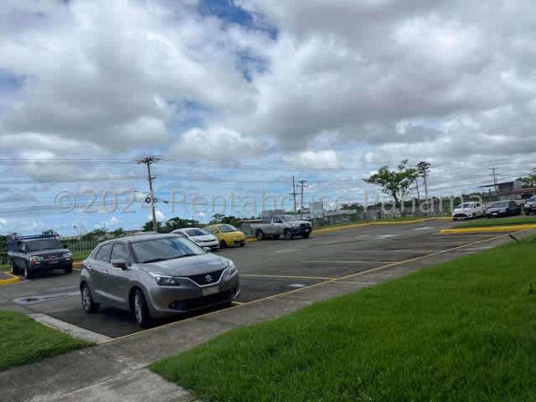 Spacious parking lot with cars beside industrial complex Pacora Panama