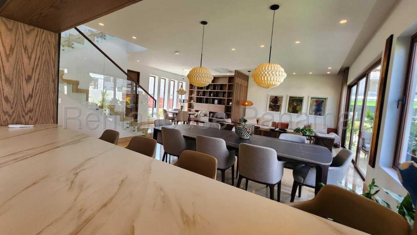 Bright living room with terrace and golf course view at The Woods Santa Maria Panama